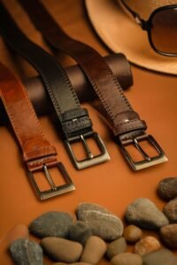 Discover premium men's leather belts in a stylish setting, perfect for luxury fashion shoots.