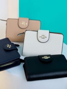 A vibrant display of leather wallets and purses in a colorful, artistic still life.
